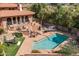 Beautiful pool area features multiple seating areas, mature trees and lush plants at 8031 N 54Th St, Paradise Valley, AZ 85253