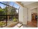 Bright sun room with large windows overlooking the lush backyard, offering a tranquil space for relaxation and enjoyment at 8031 N 54Th St, Paradise Valley, AZ 85253