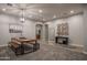 Open dining room with modern table, benches, and decorative lighting, creating an inviting atmosphere at 8544 W Mary Ann Dr, Peoria, AZ 85382