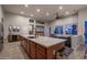 Bright, open kitchen with large center island, stainless appliances, and neutral color palette at 8544 W Mary Ann Dr, Peoria, AZ 85382