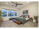 Inviting main bedroom with plush carpet, large windows, and ample natural light at 8544 W Mary Ann Dr, Peoria, AZ 85382