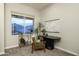 Cozy home office featuring a modern desk, stylish decor, and a view of the neighborhood at 8544 W Mary Ann Dr, Peoria, AZ 85382