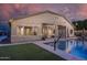 Stunning backyard oasis with pool, turf, and outdoor lighting at 8544 W Mary Ann Dr, Peoria, AZ 85382