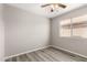 This bedroom features hardwood floors, light gray walls, and a window at 8614 W Shaw Butte Dr, Peoria, AZ 85345