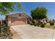 A lovely single-story home with a two-car garage and appealing landscaping at 8614 W Shaw Butte Dr, Peoria, AZ 85345