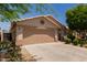 The single-story home with a two-car garage and landscaped front yard is move-in ready at 8614 W Shaw Butte Dr, Peoria, AZ 85345