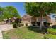 A beautiful one-story home that includes a two-car garage and is framed by mature landscaping at 8614 W Shaw Butte Dr, Peoria, AZ 85345
