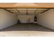Spacious two-car garage featuring concrete flooring, utility hookups, and a water heater at 8614 W Shaw Butte Dr, Peoria, AZ 85345
