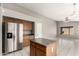 Kitchen with stainless steel refrigerator and center island at 8614 W Shaw Butte Dr, Peoria, AZ 85345