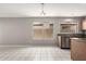 Bright kitchen with stainless steel appliances and neutral tile flooring at 8614 W Shaw Butte Dr, Peoria, AZ 85345