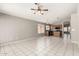 Open-concept room connecting the living area to the kitchen with neutral tile flooring at 8614 W Shaw Butte Dr, Peoria, AZ 85345