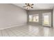 Spacious living room with bright natural light and neutral colored tile flooring at 8614 W Shaw Butte Dr, Peoria, AZ 85345