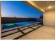 Inviting backyard features a pool, spa, covered patio, and artificial turf at 9612 E Rainbow Ave, Mesa, AZ 85212