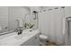 Clean bathroom featuring modern vanity, black fixtures and a tub with shower curtain at 9612 E Rainbow Ave, Mesa, AZ 85212