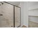 Spacious bathroom with tiled walk-in shower and a walk-in closet at 9612 E Rainbow Ave, Mesa, AZ 85212