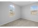 Bright bedroom with large windows providing natural light, complete with carpet at 9612 E Rainbow Ave, Mesa, AZ 85212