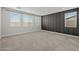 Spacious bedroom features three windows, allowing for plenty of natural light, and a dark feature wall at 9612 E Rainbow Ave, Mesa, AZ 85212
