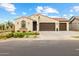 Charming single-story home featuring a stucco exterior, tile roof, and a well-manicured front yard at 9612 E Rainbow Ave, Mesa, AZ 85212