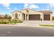 Beautiful one-story home boasts a stucco finish, tiled roof, and an attractive, low-maintenance landscape at 9612 E Rainbow Ave, Mesa, AZ 85212