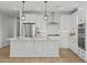 Bright kitchen featuring stainless steel appliances, a kitchen island and stylish pendant lighting at 9612 E Rainbow Ave, Mesa, AZ 85212