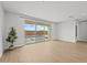 Bright living area with tile floors, large sliding glass doors view of pool and backyard at 9612 E Rainbow Ave, Mesa, AZ 85212