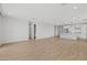 Large open-concept space with modern tile flooring, leading into the bright, white kitchen area at 9612 E Rainbow Ave, Mesa, AZ 85212