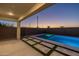 Covered patio provides a relaxing view of the beautiful pool and landscaping at 9612 E Rainbow Ave, Mesa, AZ 85212