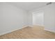 Bright, neutral bonus room featuring wood-look tile floors at 9612 E Rainbow Ave, Mesa, AZ 85212