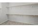 Walk-in closet with ample shelving and carpet at 9612 E Rainbow Ave, Mesa, AZ 85212