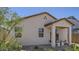 Side view of home with covered patio, gravel landscaping, and architectural details at 9627 W Cheery Lynn Rd, Phoenix, AZ 85037