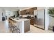 State-of-the-art kitchen with stainless steel appliances, counter seating, and ample counter space at 9627 W Cheery Lynn Rd, Phoenix, AZ 85037