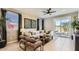 Inviting living room with access to the backyard, offers comfortable seating and contemporary design at 9627 W Cheery Lynn Rd, Phoenix, AZ 85037
