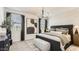 Well-lit main bedroom features stylish furniture, plush bedding, and a peaceful atmosphere at 9627 W Cheery Lynn Rd, Phoenix, AZ 85037