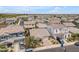 This aerial view highlights the meticulously planned neighborhood with sidewalks, enhancing its desirability and accessibility at 9853 E Solstice Ave, Mesa, AZ 85212