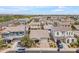 This aerial showcases the neatly arranged neighborhood with well-maintained lawns, providing a pleasant residential environment at 9853 E Solstice Ave, Mesa, AZ 85212
