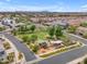 Charming aerial view of the community park with playground and picnic area among the homes at 9853 E Solstice Ave, Mesa, AZ 85212
