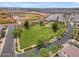 Aerial view of sports fields and a community park with lush green space and nearby residences at 9853 E Solstice Ave, Mesa, AZ 85212