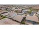 This aerial captures the neighborhood's well-organized streets and diverse home styles, creating a balanced community atmosphere at 9853 E Solstice Ave, Mesa, AZ 85212