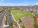 This aerial captures the sprawling green spaces and recreational park, promoting an active and healthy lifestyle for residents at 9853 E Solstice Ave, Mesa, AZ 85212