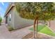 The backyard offers a quaint outdoor space with artificial turf and a paver walkway at 9853 E Solstice Ave, Mesa, AZ 85212