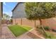 The backyard features a small, well-maintained lawn area and low-maintenance landscaping at 9853 E Solstice Ave, Mesa, AZ 85212