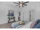 Stylish bedroom showcases a comfortable bed, modern decor, and a glimpse into the home's inviting living spaces at 9853 E Solstice Ave, Mesa, AZ 85212