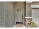 Inviting front entrance featuring a decorative wreath, and stylish welcome mat at 9853 E Solstice Ave, Mesa, AZ 85212