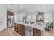 Modern kitchen with stainless steel appliances, granite counters, and an open design for easy entertaining at 9853 E Solstice Ave, Mesa, AZ 85212