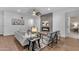 Tastefully decorated living room featuring a fireplace, comfortable seating, and modern accents at 9853 E Solstice Ave, Mesa, AZ 85212