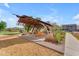 Park featuring shaded seating and playground structures at 9853 E Solstice Ave, Mesa, AZ 85212