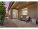 A covered patio offers a cozy seating area for relaxing and enjoying the outdoors at 9853 E Solstice Ave, Mesa, AZ 85212