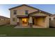 Well-maintained backyard featuring artificial grass lawn and covered patio at 9911 E Telemetry Dr, Mesa, AZ 85212
