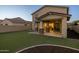 Artificial grass yard and covered patio of a desert home at 9911 E Telemetry Dr, Mesa, AZ 85212