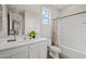 Stylish bathroom offers a single sink vanity, modern fixtures, and a shower over tub at 9911 E Telemetry Dr, Mesa, AZ 85212